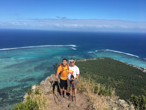 photo of erik weihenmayer and wife ellie on cliff overlooking ocean post hike