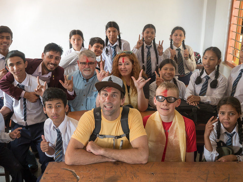 a photo of erik and participants with the students at srijana school for the deaf in nepal