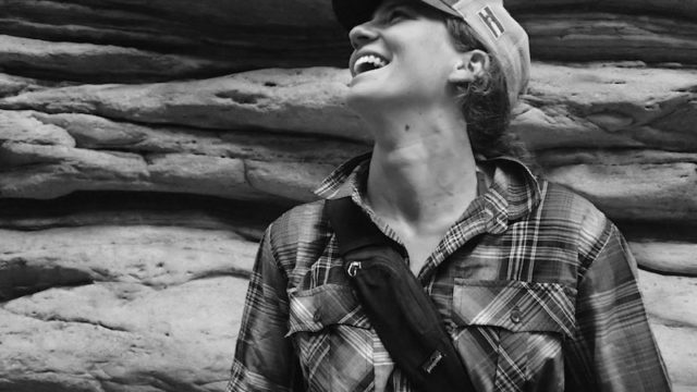 a photo of erin agee looking up and laughing taken at the grand canyon