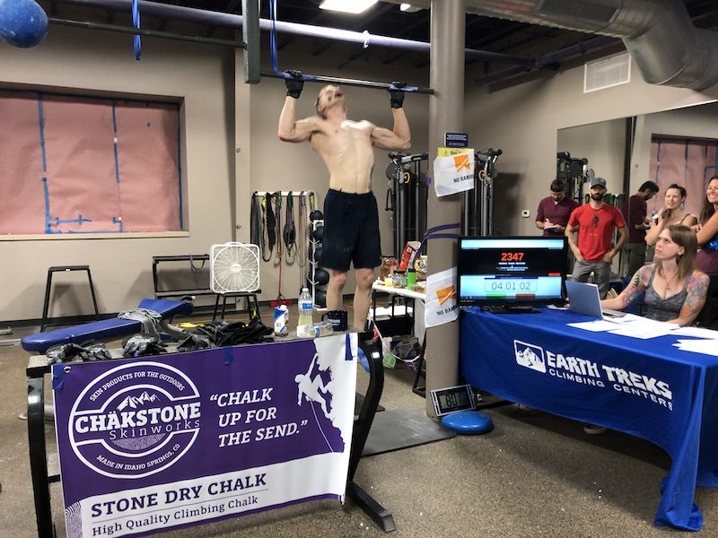 a photo of john orth doing pull ups at a climbing gym with a counter at 2347