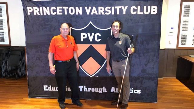 a photo of ed weihenmayer and erik weihenmayer in front a banner that says princeton varsity club at princeton university
