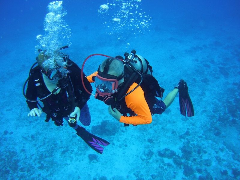 a photo of joe scuba diving with his wife cherie