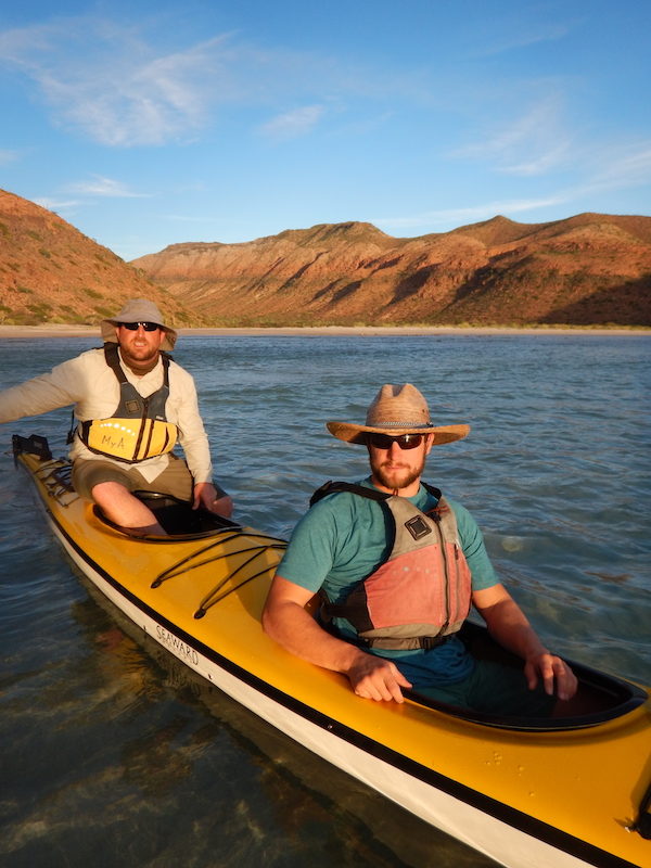 two men in a tandem kayak