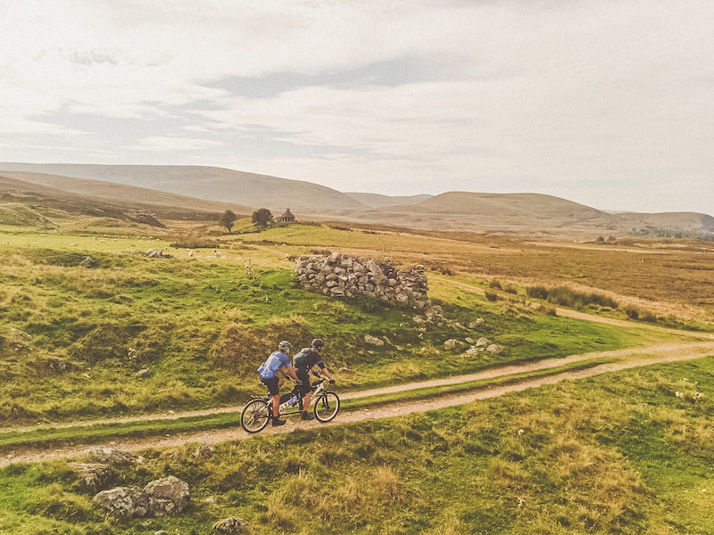 Erik and Daniel tandem cycling across the Highlands