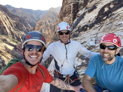 Connor, Charley, and Erik taking a selfie mid-climb.